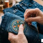 sewing patches on denim